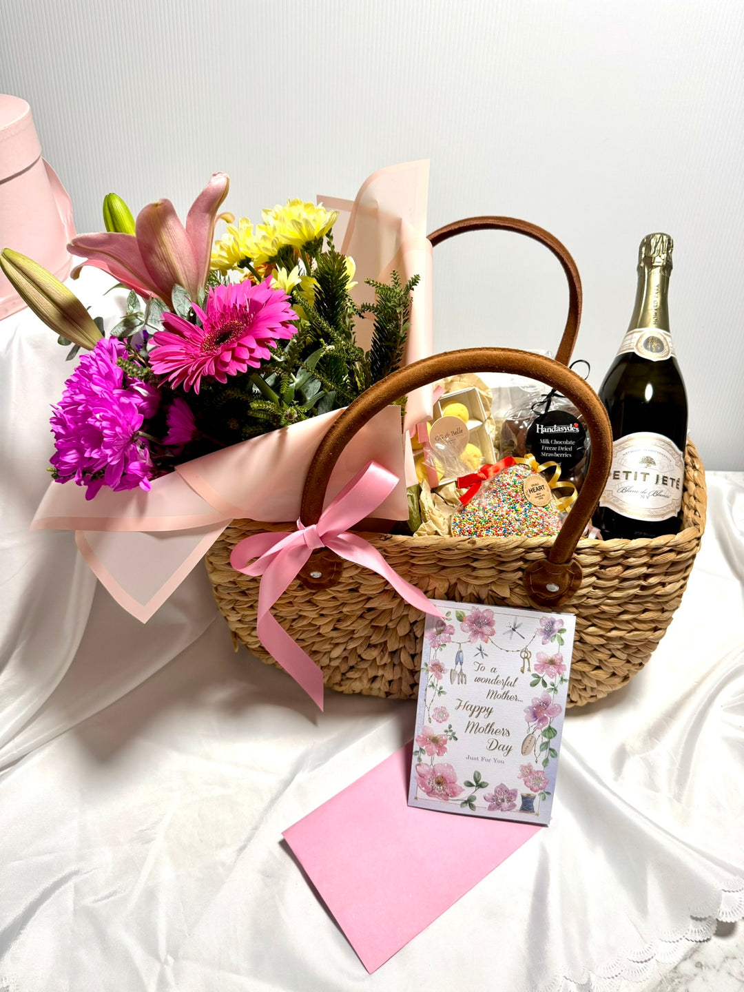 Basket with Sparkling Wine, Chocolates &amp; Flowers