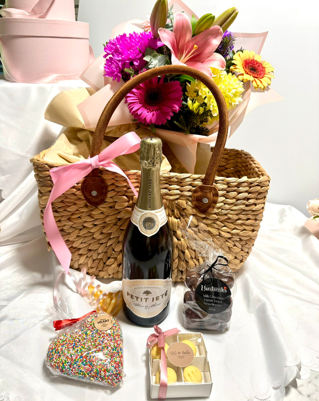 Basket with Sparkling Wine, Chocolates &amp; Flowers