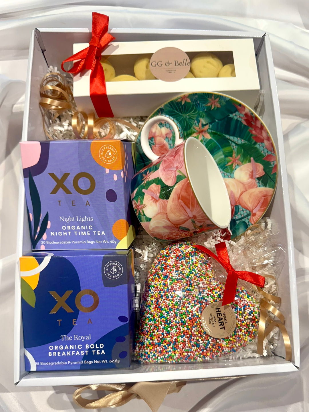 XO Tea, Cup &amp; Saucer set with sweet treats